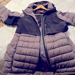 Woman’s grey winter jacket by Canada Goose. Size XL